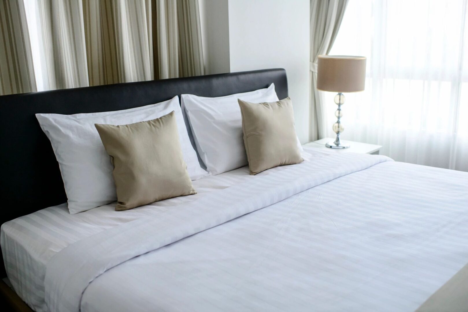 Bedroom with lamp beside bed